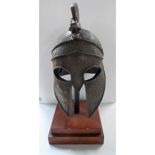 43 - Greek/Corinthian warrior helmet, cast bronze powder, polyester resin on plinth

Helmet - 47cm x 30 x... 