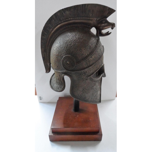 43 - Greek/Corinthian warrior helmet, cast bronze powder, polyester resin on plinth

Helmet - 47cm x 30 x... 