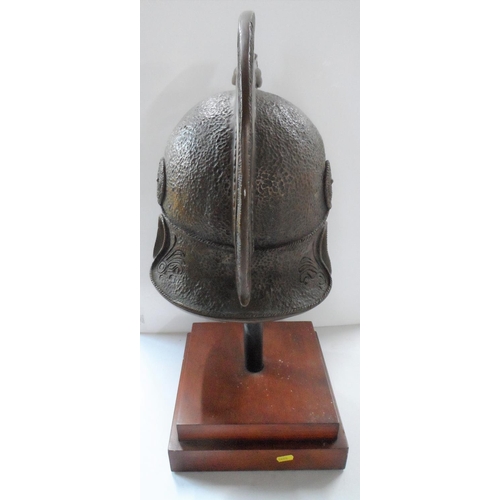 43 - Greek/Corinthian warrior helmet, cast bronze powder, polyester resin on plinth

Helmet - 47cm x 30 x... 