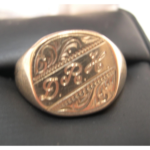 25 - 9ct yellow gold, gents signet ring, initialled D.R.M

Approx 9 grams,                size U