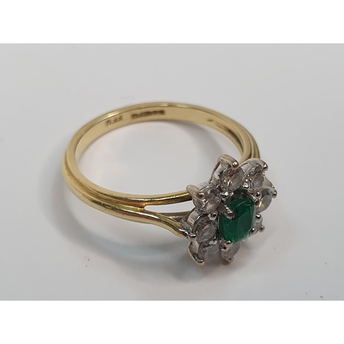39 - 18ct yellow gold ring set with an oval cut Emerald surrounded by 8 round cut diamonds.

Gross weight... 