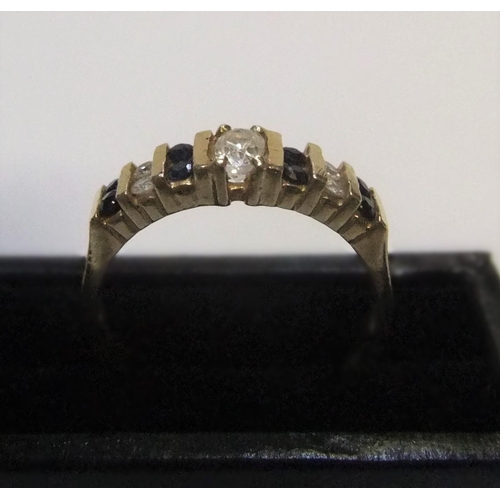 51 - 14ct yellow gold ring set with alternating sapphire & diamonds

approx 3.1 grams gross,           si... 