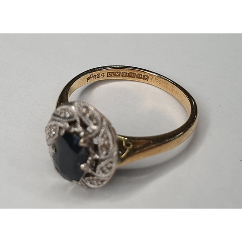 55 - 18ct yellow gold Sapphire and diamond ring (approx 0.4ct gross) surrounded by eight round cut diamon... 
