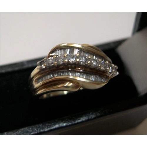 57 - 9ct yellow gold ring set with approx 38 diamonds, total weight approx 0.45ct.

The central row consi... 