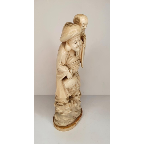 108 - Meiji period, Japanese carving of Deity with a mallet carrying a child 21cm tall