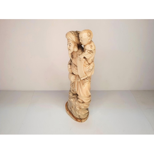 108 - Meiji period, Japanese carving of Deity with a mallet carrying a child 21cm tall