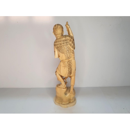 111 - Meiji period, Japanese carving of a fisherman.  27 cm tall