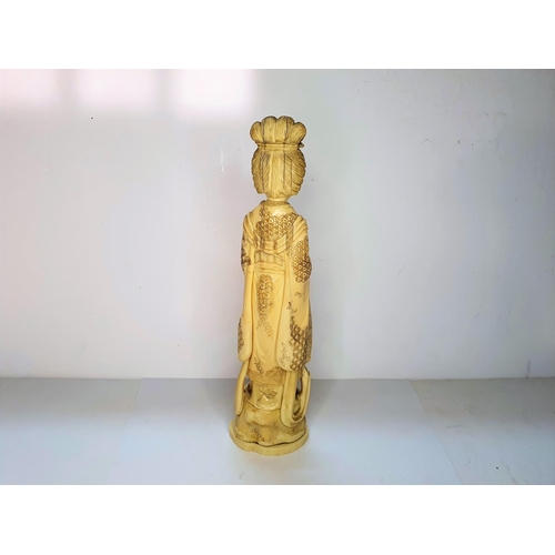 115 - Meiji period, Japanese carving of Geisha carrying a flower.  21 cm tall