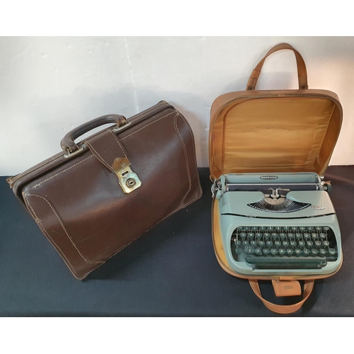 168 - Royalite portable typewriter in original case together with a vintage briefcase (2)