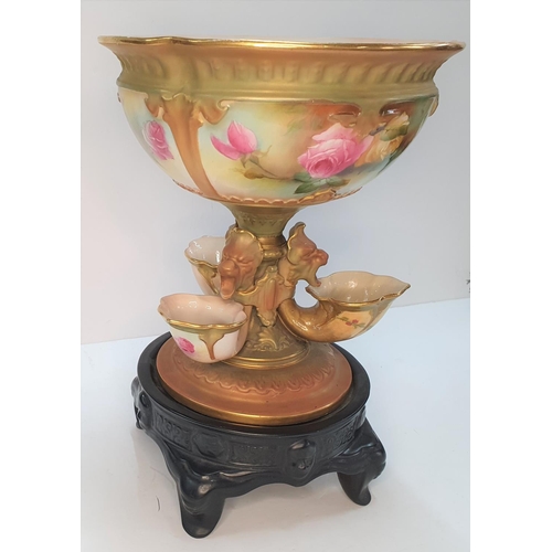 300 - A Royal Worcester blush ivory ground porcelain centre piece in the form of a central bowl on a taper... 