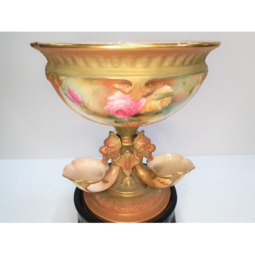 300 - A Royal Worcester blush ivory ground porcelain centre piece in the form of a central bowl on a taper... 