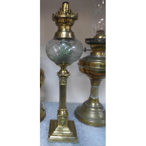 379 - Fine quality brass columned stem oil lamp together with 2 others, 1 converted (3)