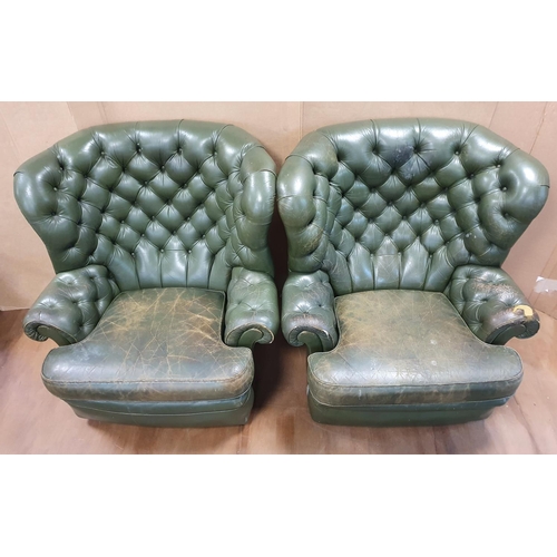 540 - Two vintage, over-sized green leather Chesterfield wing back armchairs (a/f)