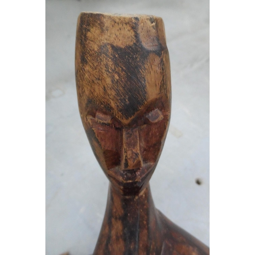 543 - Carved and intertwined African wooden table base with carved head decoration