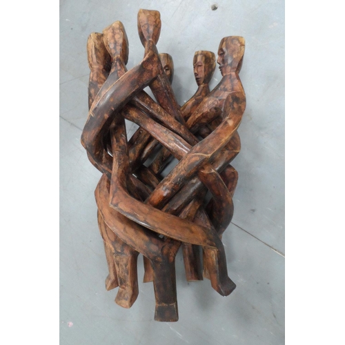 543 - Carved and intertwined African wooden table base with carved head decoration