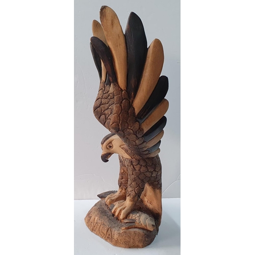 415 - 2005 carved wooden eagle by Delroy Henlon,

Approx 58 cm tall