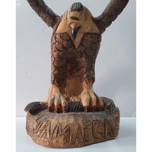 415 - 2005 carved wooden eagle by Delroy Henlon,

Approx 58 cm tall