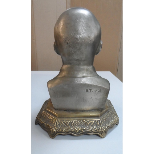 358 - Mid 20thC Russian school, white metal bust of Lenin, signed in Cyrillic and placed on a metal stand,... 