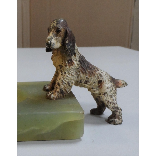 101 - Edwardian cold painted bronze Spaniel dog leaning on an Onyx ashtray