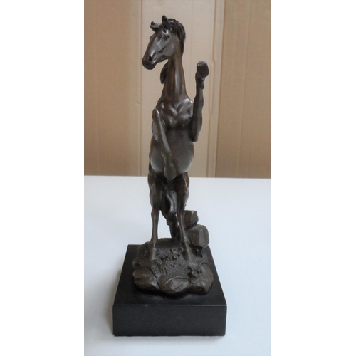 97 - Unsigned, well cast, 20thC bronze depicting a rearing horse on plinth,

27 cm tall