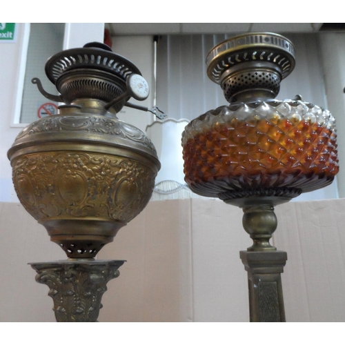 380 - Two antique tall columned oil lamps (2)