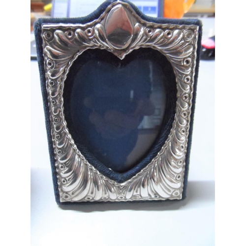 23 - Small silver tankard together with a pleasing heart shaped silver fronted photo frame (2),

Marks pa... 