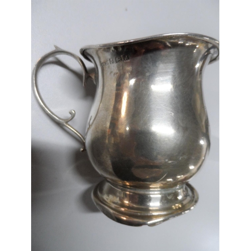 23 - Small silver tankard together with a pleasing heart shaped silver fronted photo frame (2),

Marks pa... 