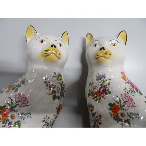 307 - Pair of old, unmarked Staffordshire cats,

25 cm tall