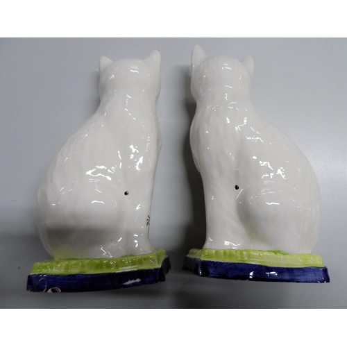 307 - Pair of old, unmarked Staffordshire cats,

25 cm tall