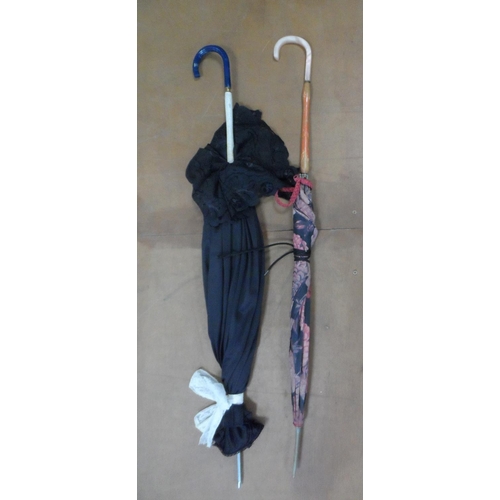 136 - Collection of walking sticks, a foil, 2 parasols & umbrellas etc (12)