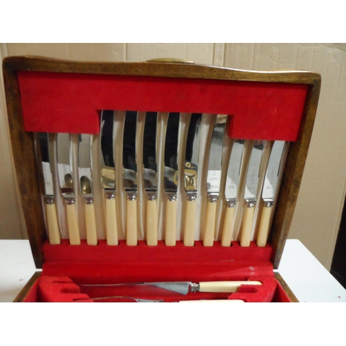 451 - Mid 20thC oak cased cutlery set together with other loose mid 20thC cutlery (Qty)