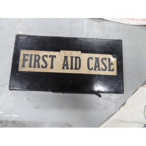 143 - WWII A R P first aid box with 2 original bandages with printed bandage instructions together with a ... 