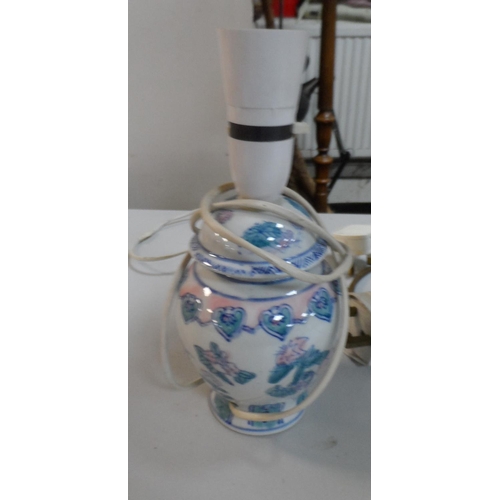 460 - Three table lamps to include a Moorcroft style example and a Parian style lamp (3)