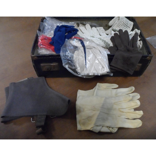 256 - Vintage ladies suitcase filled with a huge quantity of vintage ladies gloves to include leather and ... 