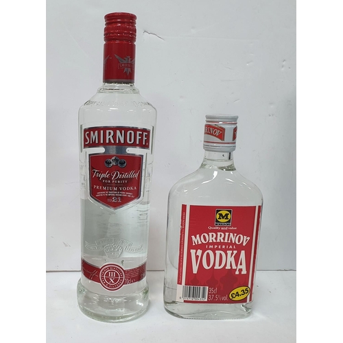 394 - Two bottle of Gordons Gin together with 2 bottles of Vodka (4)