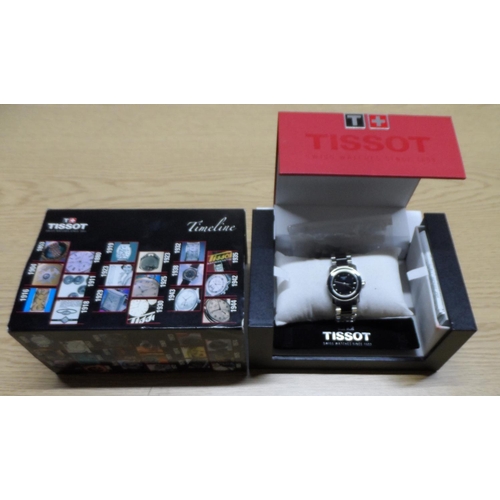 100 - Boxed Tissot unisex watch complete with links and paperwork