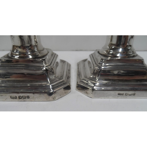4 - Pair of Edwardian silver, squat Art Nouveau style candlesticks (2),

11 cm tall