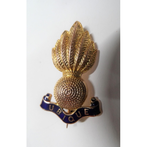 76 - 9ct gold, Royal Artillery cap badge,

4.5 grams