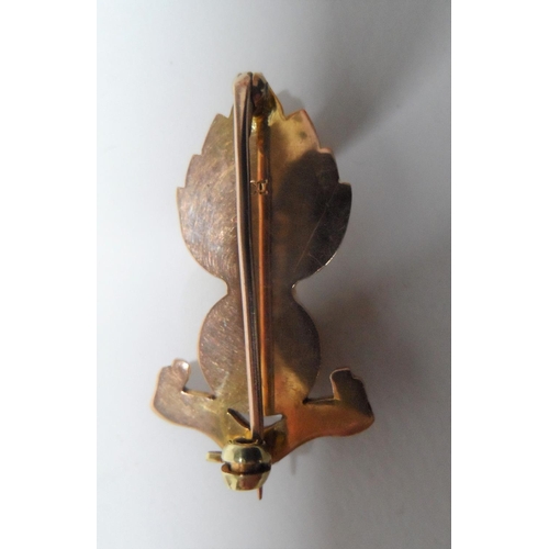 76 - 9ct gold, Royal Artillery cap badge,

4.5 grams