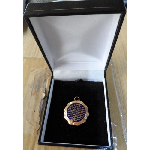 44 - 18ct yellow gold pendent with enameled Arabic script frontage,

2.3 grams gross