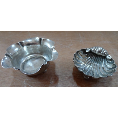 25 - Four pieces of British Edwardian silver including a small 4-part toast rack (4)