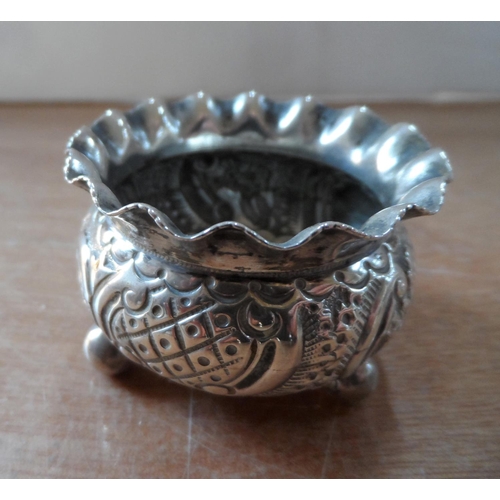 25 - Four pieces of British Edwardian silver including a small 4-part toast rack (4)