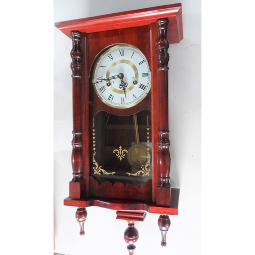 110 - Late 20thC wall hanging clock compete with key