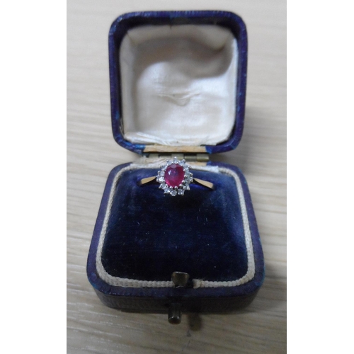 42 - 9ct yellow gold ladies ruby ring surrounded by diamonds,

1.8 grams gross            N1/2