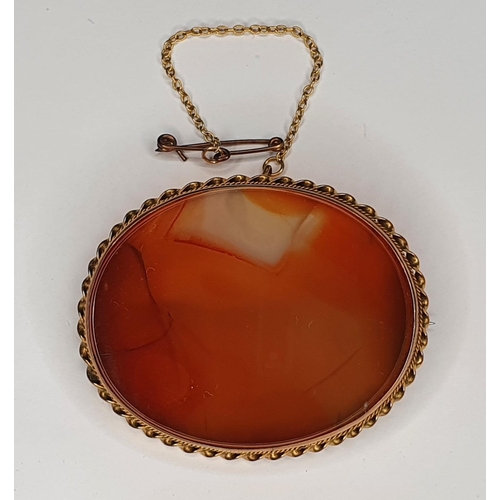 60 - Antique hardstone oval brooch in 9ct gold setting