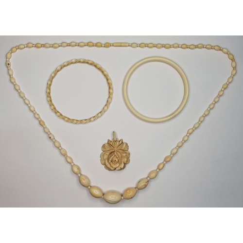 64 - Antique ivory set including necklace and 2 bangles (4)