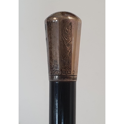 135 - Ebonised silver topped baton