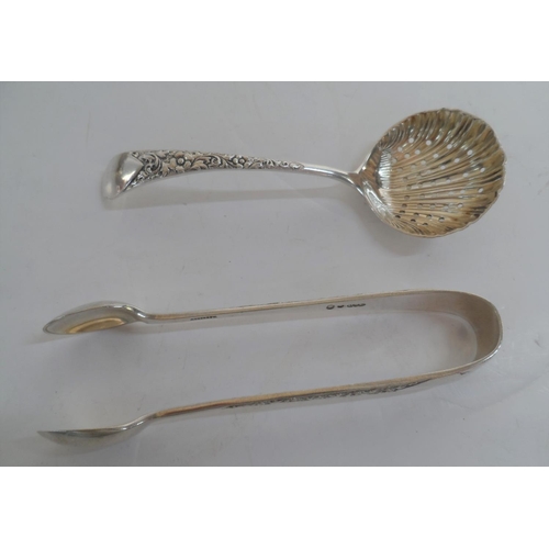 34 - Four various Edwardian silver napkin rings together with a pair of silver sugar nips and a silver su... 