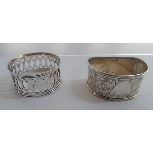34 - Four various Edwardian silver napkin rings together with a pair of silver sugar nips and a silver su... 