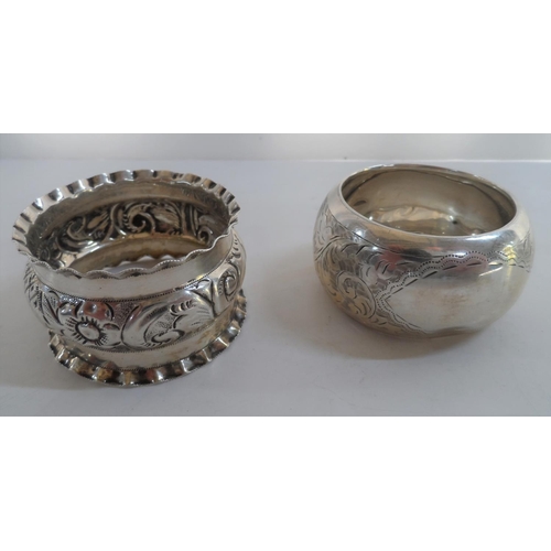 34 - Four various Edwardian silver napkin rings together with a pair of silver sugar nips and a silver su... 